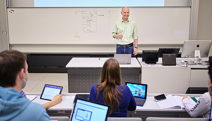 Professor teaching at a lecture hall