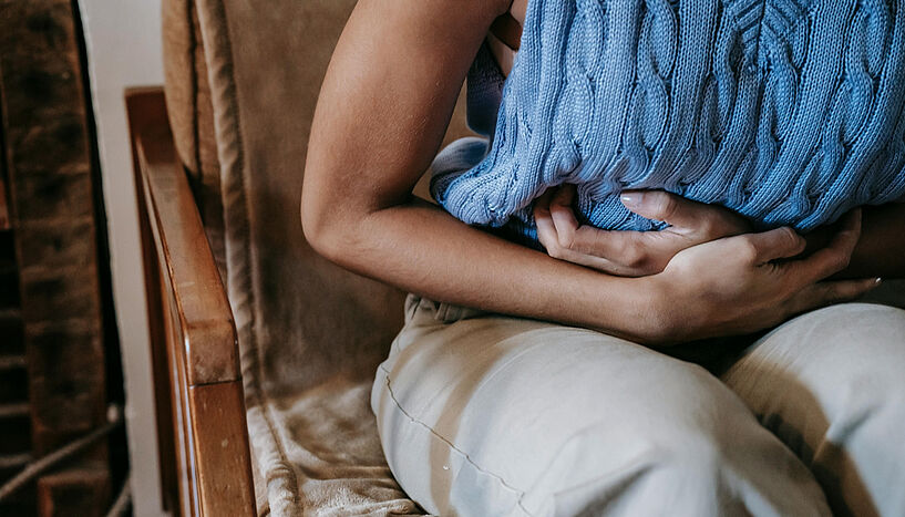 Picture of a woman holding her belly